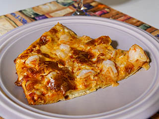 A piece of our famous shrimp pizza!